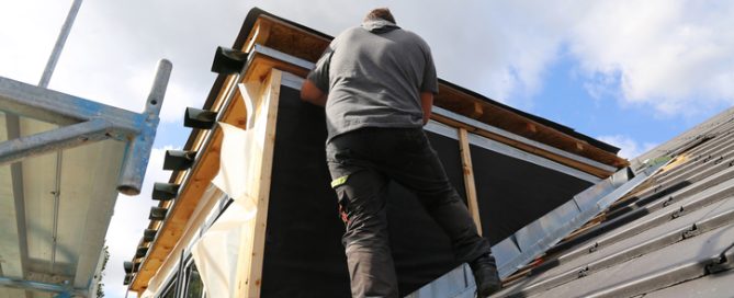 Roofing contractor working on a new dormer